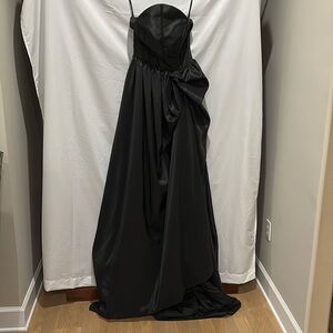 Beautiful black evening gown with high slit.